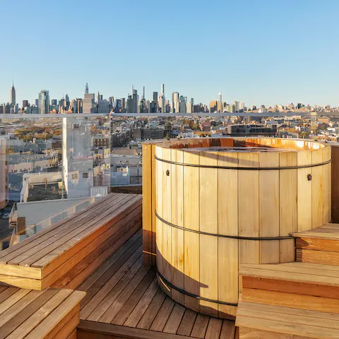 Slip into the hot tub and relax as you admire the skyline