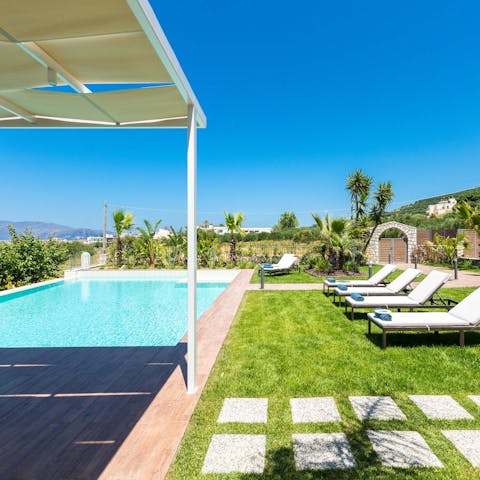 Soak up the Cretan sun by the private pool