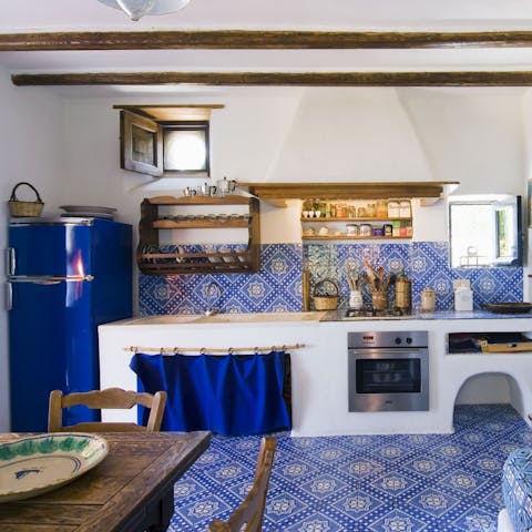 Whip up your favourite Italian dishes in the pretty tiled kitchen