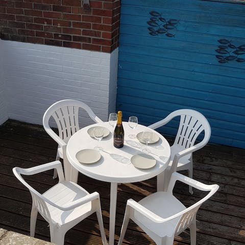 Return to the patio for an evening tipple after sharing fish and chips
