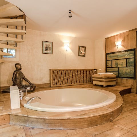 Treat yourself to a soak in this unique, sunken tub