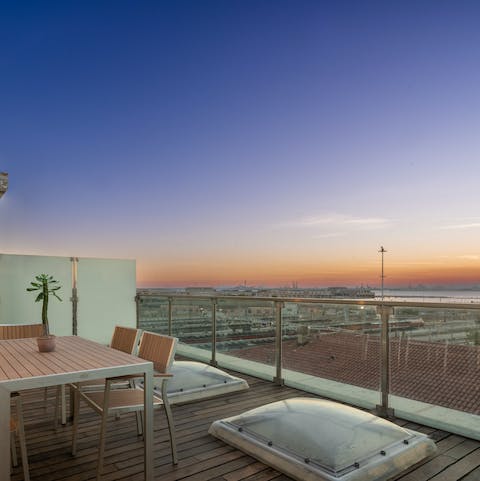 Admire the views over Venice at sunset from your private terrace