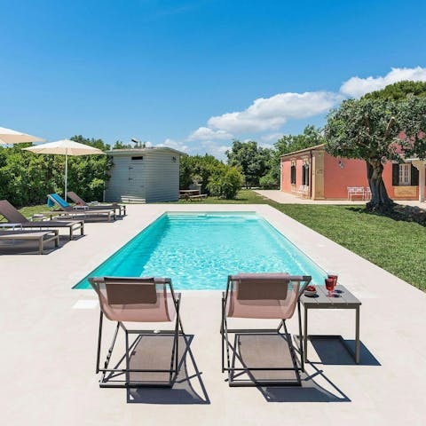 Soak up the Sicilian sun from in or beside the private pool