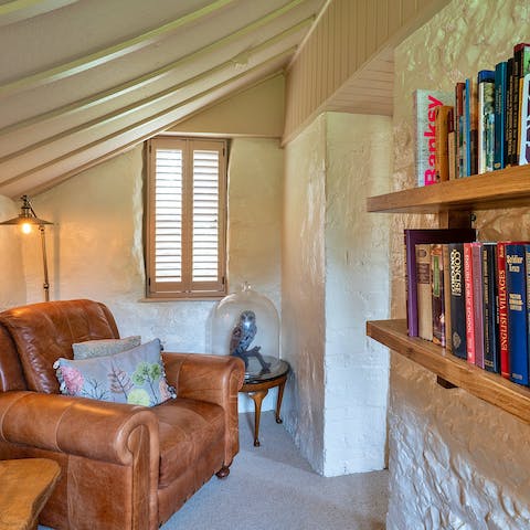 Lose yourself to a classic in the cosy library nook for two