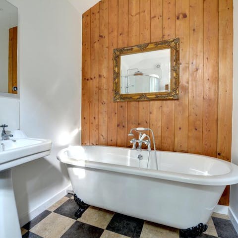 Treat yourself to a long soak in the freestanding tub after a day by the coast