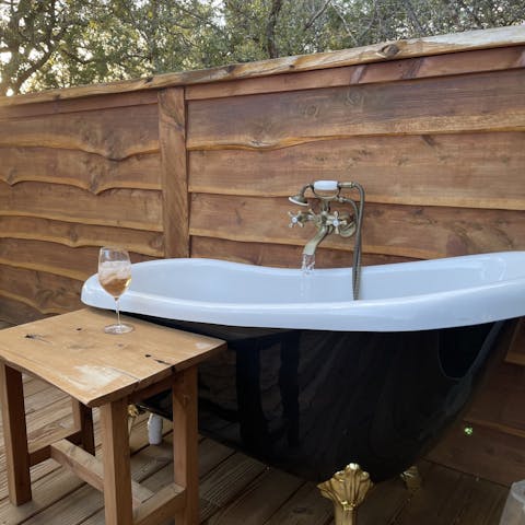 Treat yourself to a long soak in the open-air bathtub on the deck