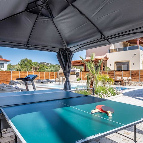 Challenge friends and family to a game of table tennis on the shaded terrace