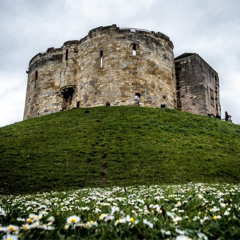 Start your York adventure at Clifford's Tower, just a six-minute jaunt over the Floss River 