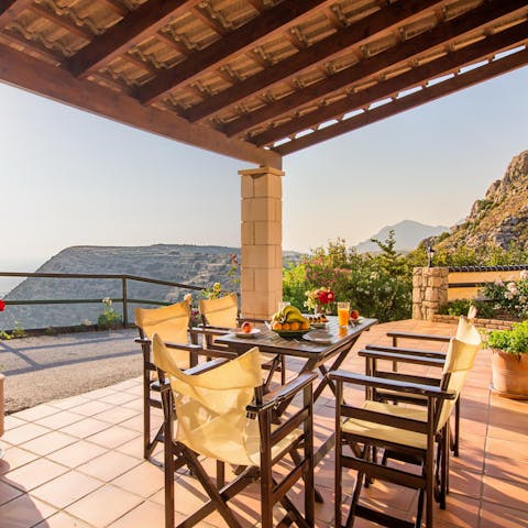Enjoy the light of golden hour against the mountains on the dining terrace