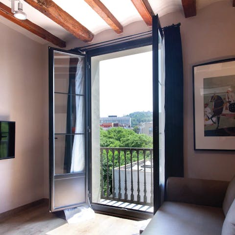 Enjoy sunlight streaming into the living room from French windows