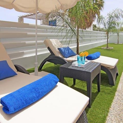 Relax on the comfy garden sun loungers