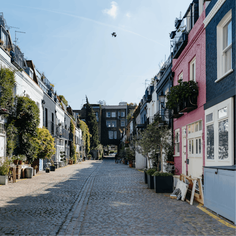 Explore Notting Hill's colourful houses and the party-like atmosphere