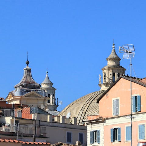 Enjoy the view of Rome's historic buildings from your rooftop