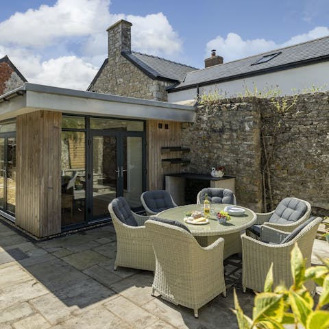 Enjoy alfresco meals in the sun-drenched courtyard garden