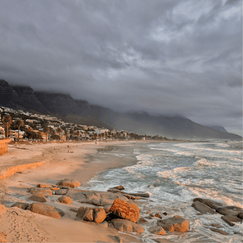 Take a surf lesson at Camps Bay Beach – it's a short drive away