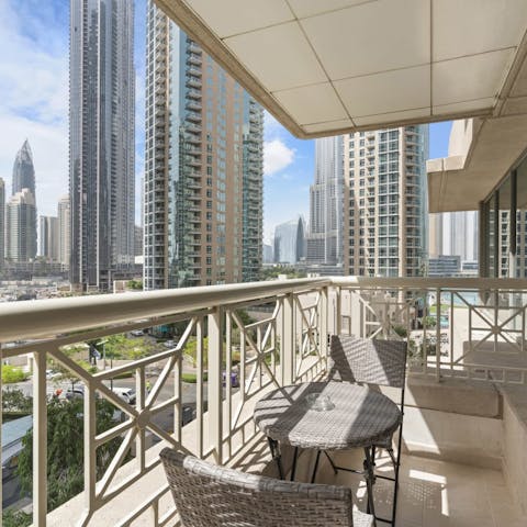 Look out to the inspiring city skyline from your private balcony