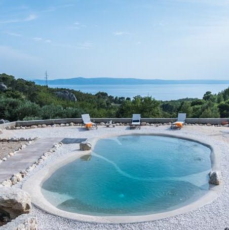 Admire views of the Adriatic Sea from the poolside