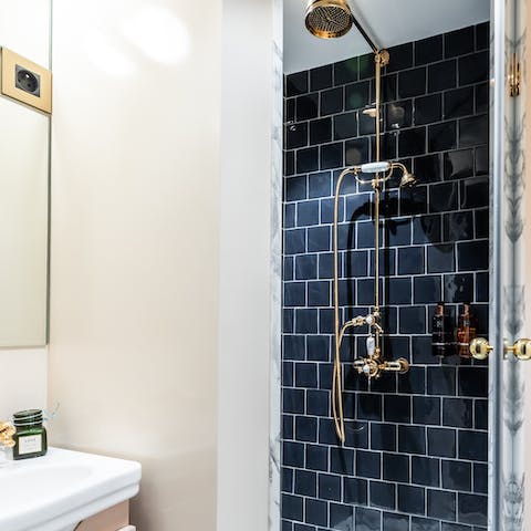 Start your day with a relaxing soak in the gold-accented shower
