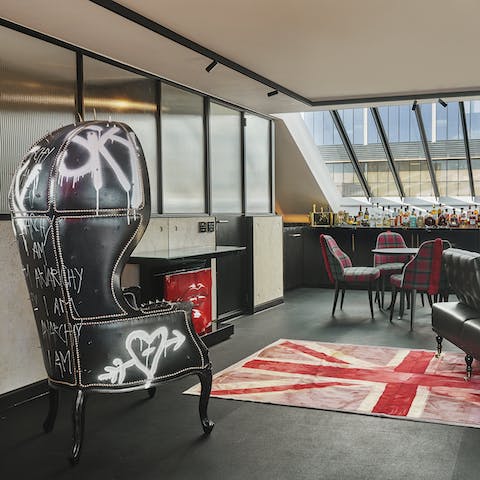 Enjoy uninterrupted views of London's city skyline from your punk rock inspired sitting room