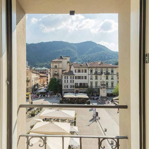 Admire the views over Piazza Volta from the living room