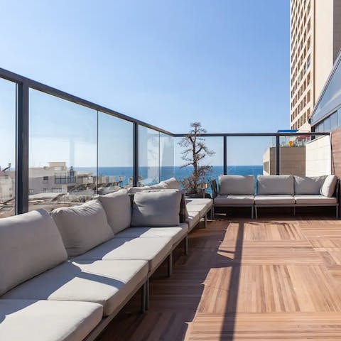Pour yourself a glass of your favourite tipple and watch the sun melt into the sea