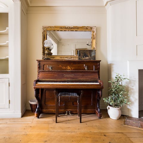 Play a tune on the living room's piano 
