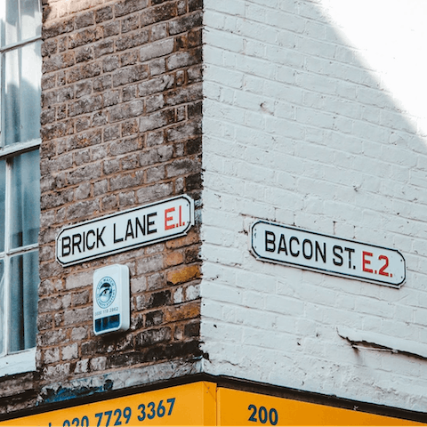 Explore Brick Lane's multicultural restaurants and vintage shops, a five-minute walk away