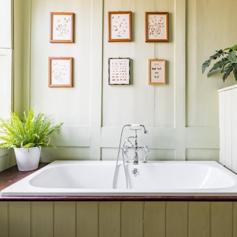Finish evenings off with a long soak in the master bathroom's vintage tub