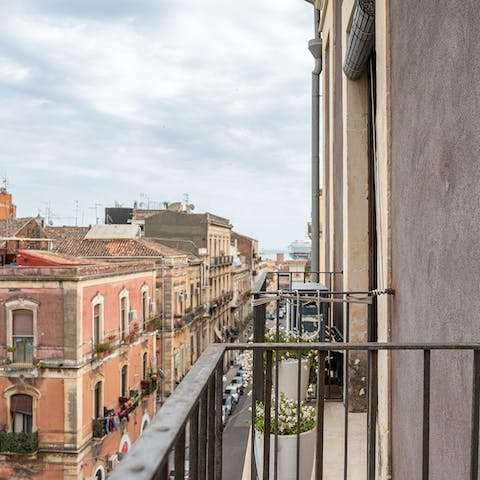 Admire the Sicilian architecture from your own balcony