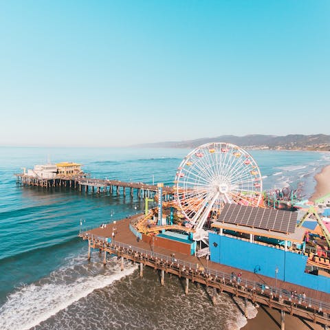 Spend sunny days at Santa Monica Beach, less than a fifteen-minute drive away