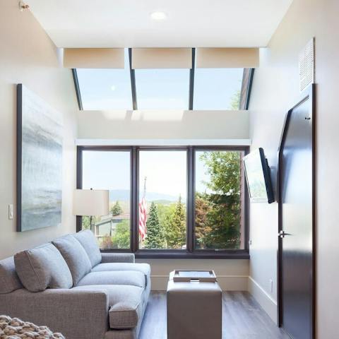 Chill out to mountain views through the double height windows