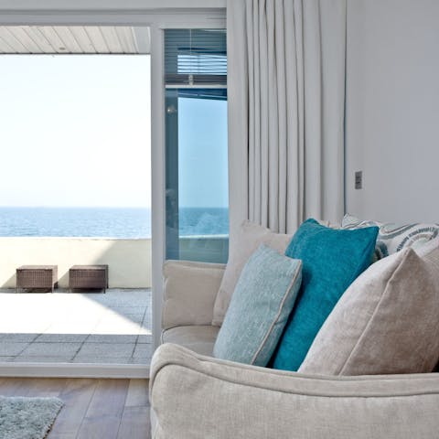 Slide open the glass doors to let the ocean breeze into the living room