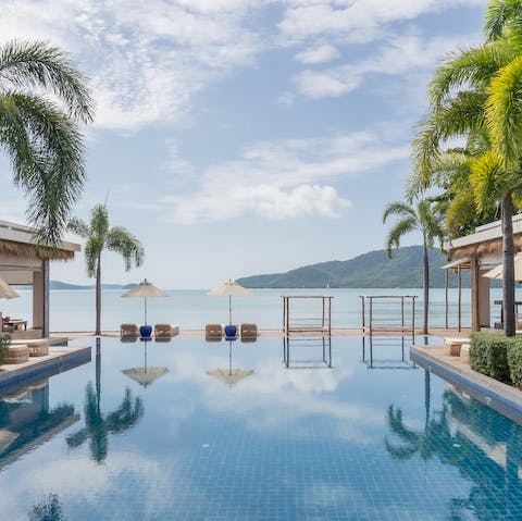 Dip your toes into the refreshing communal pool by the sea