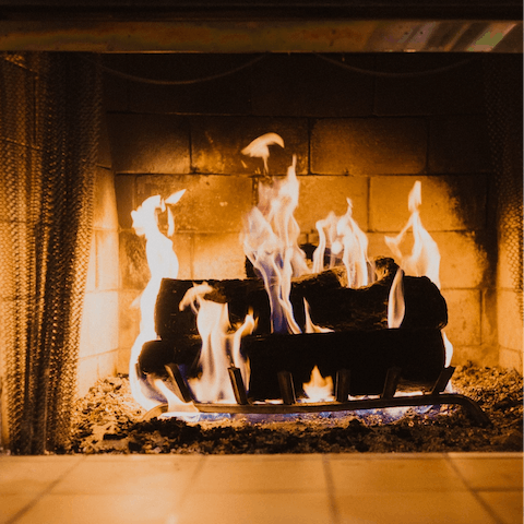 Spend cosy evenings snuggled up beside the wood-burning fireplace