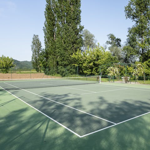 Play a round of mixed doubles on the private tennis court