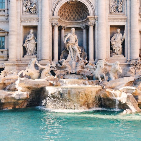 Throw a coin into the Trevi Fountain, located a twenty five minute metro away 