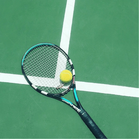 Practice your serve on the shared tennis courts
