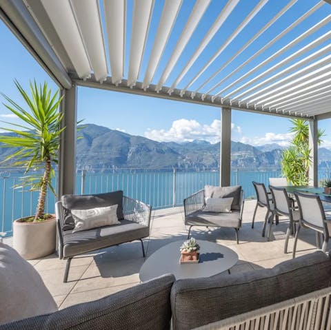 Sip an Aperol Spritz on the terrace with a view over Lake Garda 