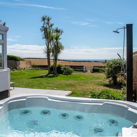 Unwind in the hot tub after a day of surfing on the beach