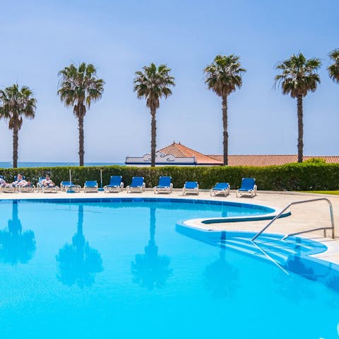 Go for a dip in the large communal pool or laze on the sun loungers