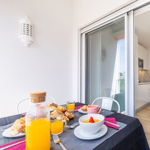 Enjoy breakfast on the private balcony to start your day