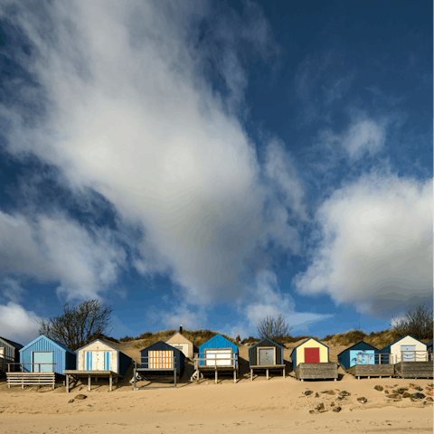 Make the ten-minute drive to the beach-hut-lined sand of Abersoch