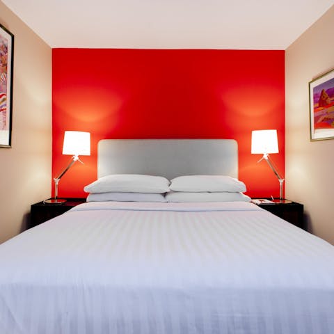 Rest easy in the plush king-sized bed, swathed in soft, luxury linens