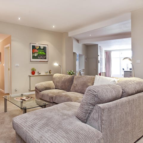 Sink into the squishy L-shaped sofa after a busy day exploring and rest tired feet