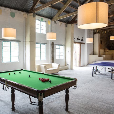 Chill out in the games space, set up in a rustic converted barn