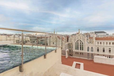 Swim in the communal pool with views across Madrid