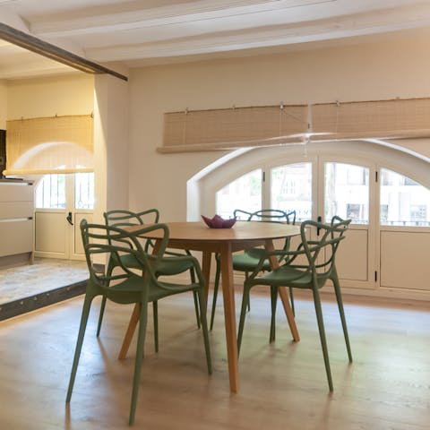 Gather together for a celebratory meal at the scenic dining table framed by arched windows
