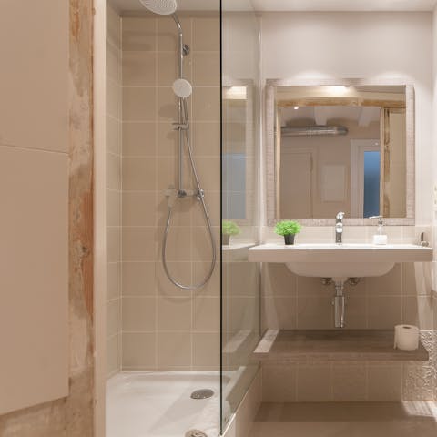 Start mornings with a relaxing soak under the bathroom's rainfall shower