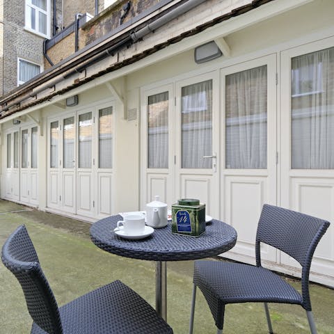 Wake up with a strong cup of tea on the communal patio