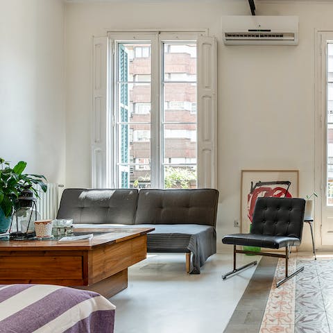Relax in the bright living room after a day of exploring Barcelona on foot